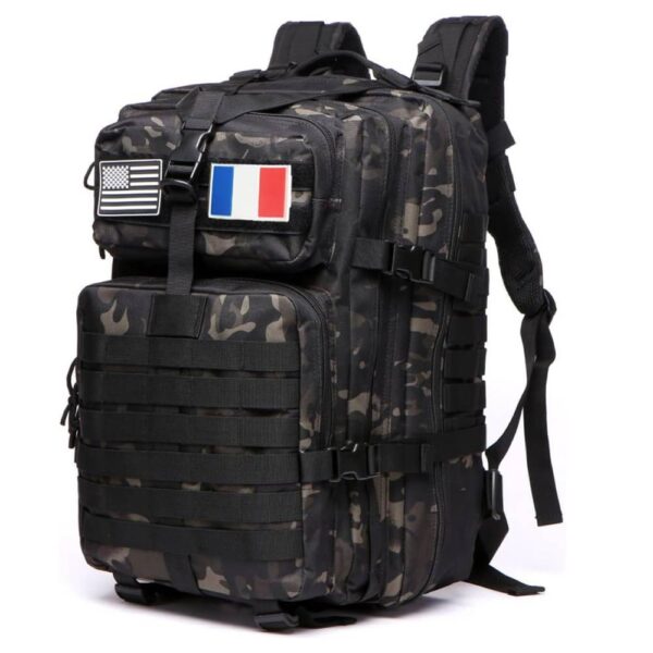 Camouflage tactical backpack with MOLLE straps and patches showing US and French flags, multiple compartments.
