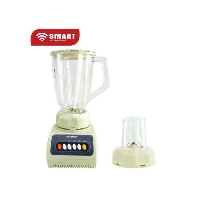 Cream-colored blender with a tall glass pitcher and a separate small jar on the side, branded Smart Technology graphic visible above the setup.