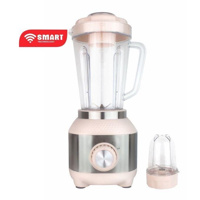 Pink and satin‑silver countertop blender with glass pitcher and a separate small grinding jar, featuring a circular dial and two speed settings, labeled 'Smart Technology' badge on the top left.