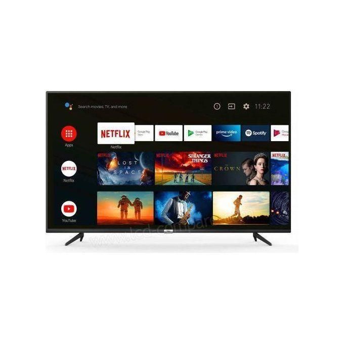 Flat-screen smart TV on a stand showing streaming apps and movie thumbnails.