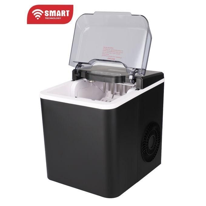 Countertop ice maker with transparent lid open, white interior, black housing, branded Smart Technology logo in corner.