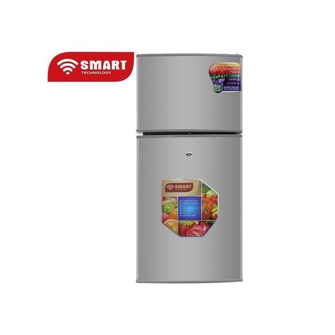 Silver two-door fridge with Smart Technology label on the top left and colorful stickers on the lower door area.
