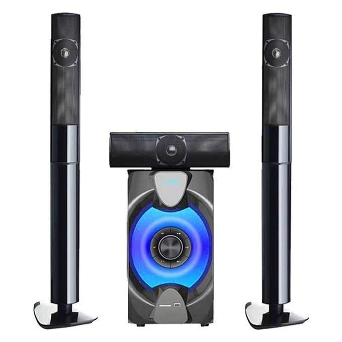 Home theater speaker system with two tall floor-standing speakers, a center speaker, and a blue-lit subwoofer.