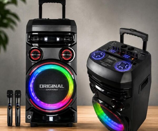 Two black party speakers with rainbow LED rings on the front, paired with two wireless microphones on a wooden floor for a karaoke setup.