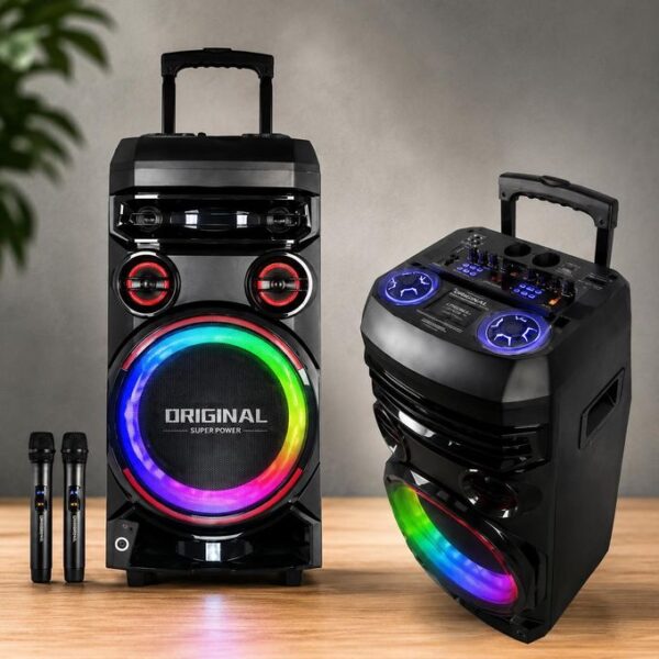 Two black party speakers with rainbow LED rings on the front, paired with two wireless microphones on a wooden floor for a karaoke setup.
