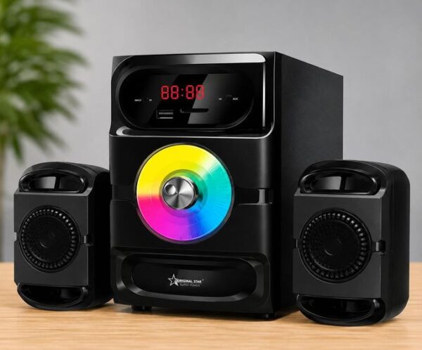 Black multi-piece home stereo system with a rainbow-colored CD on the front disc and two satellite speakers on either side, placed on a wooden surface.