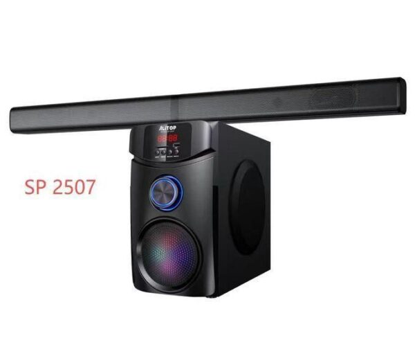 PC-style home audio speaker system with a long top bar and a standalone subwoofer; model SP 2507 visible on the unit.