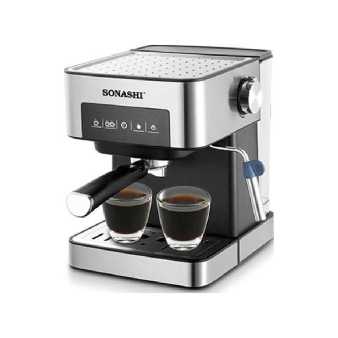 Sonashi stainless steel espresso machine brewing two espresso shots into glass cups on a drip tray with steam wand nearby.