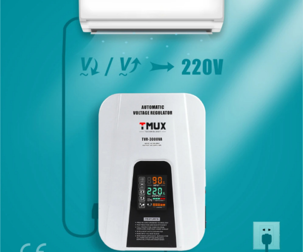 Air conditioner connected to a white automatic voltage regulator mounted on a teal wall, with 220V output shown between them, and a power cord plugged in at the bottom left.",