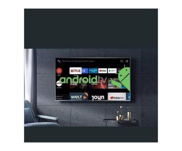 Flat-screen TV on a dark paneled wall displaying Android TV home screen with app icons and a green Android mascot overlay on the right.