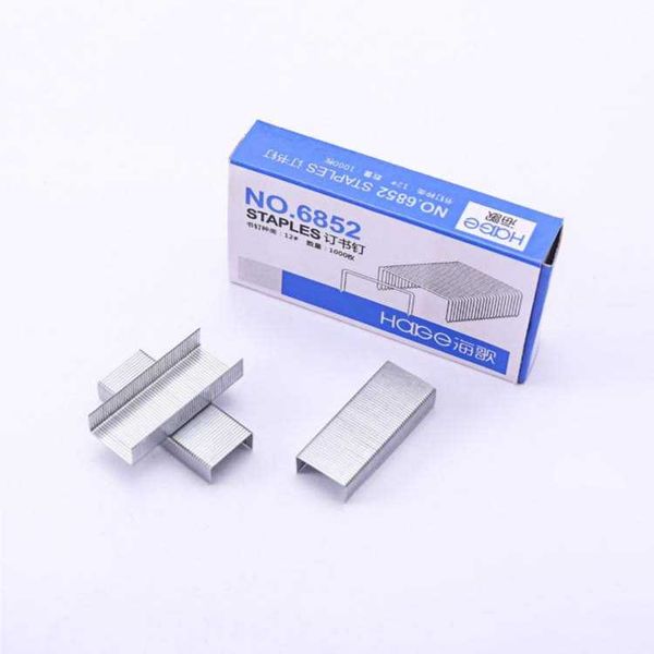 Box of staples with loose metal staples on a white surface, an office-supply image suitable for a stapler.
