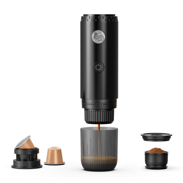 Disassembled black coffee capsule device with lid and several capsules separated, showing internal parts and ground coffee cups lined up below