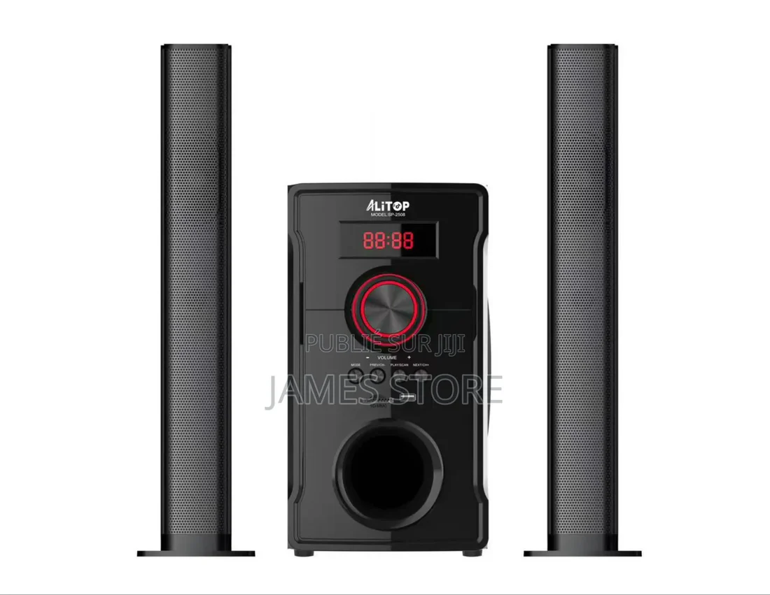 Black home theater speaker system: two tall satellite speakers flanking a central subwoofer with a red-lit control knob and LED display.