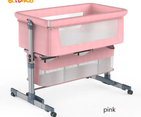 Pink baby bassinet on a height‑adjustable, wheeled stand with mesh sides for ventilation.