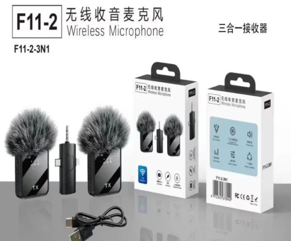 Dual wireless microphone system with two furry windscreen mics, USB cable, and product boxes labeled F11-2.