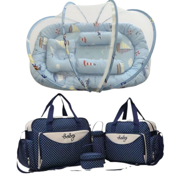 Navy blue polka-dot diaper bag set with multiple compartments and matching changing pad and accessories.