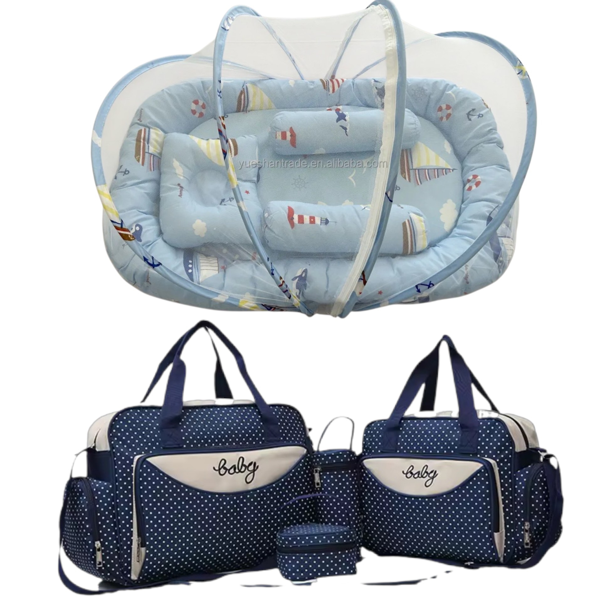 Navy blue polka-dot diaper bag set with multiple compartments and matching changing pad and accessories.
