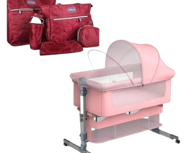 Pink baby playpen with mesh sides and canopy, shown with red quilted travel bags in the background.
