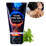 Tube of Ikzee Titan Pro Gel with blue and orange flame design and branding visible, with mint leaves nearby.