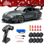 RC toy sports car with large rear wing and racing tires, plus remote and accessories on a white background with a Christmas banner above
