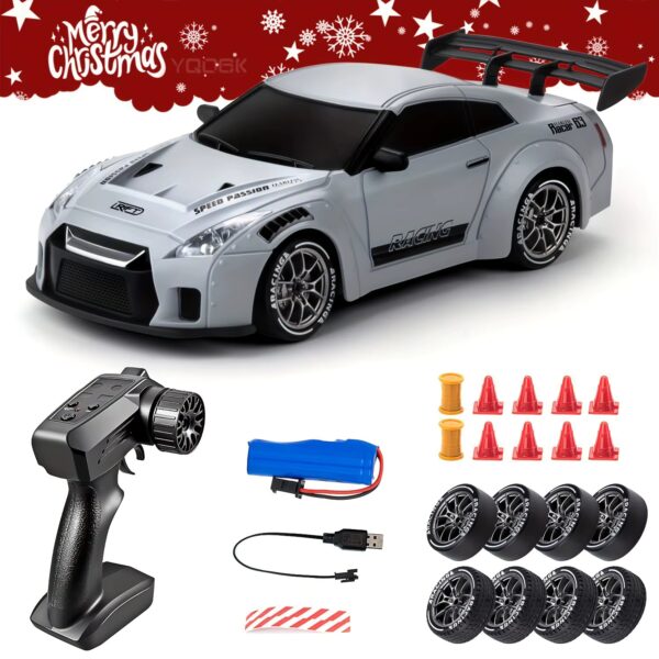 Remote-controlled toy race car with spoiler and racing decals, plus accessories like battery pack and charger fall out around it.