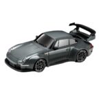 Gray toy sports car with a large rear wing and black racing wheels viewed from a side angle with decals along the lower body