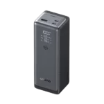 Dark gray portable power station standing upright with a digital display showing 100% and USB ports on top (Orimo brand).