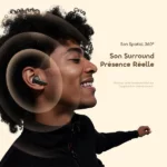 Young man wearing a wireless earbud; concentric sound waves illustrate the Son Spatial 360° product on a light background with the text 'Son Surround Présence Réelle'.