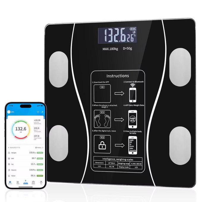 Black digital bathroom scale with a large 132.6 kg readout and a smartphone showing the weight-tracking app beside it.